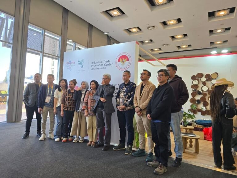 Exhibitors and officials in front of the Indonesia Trade Promotion Center Johannesburg backdrop at Decorex Johannesburg 2026