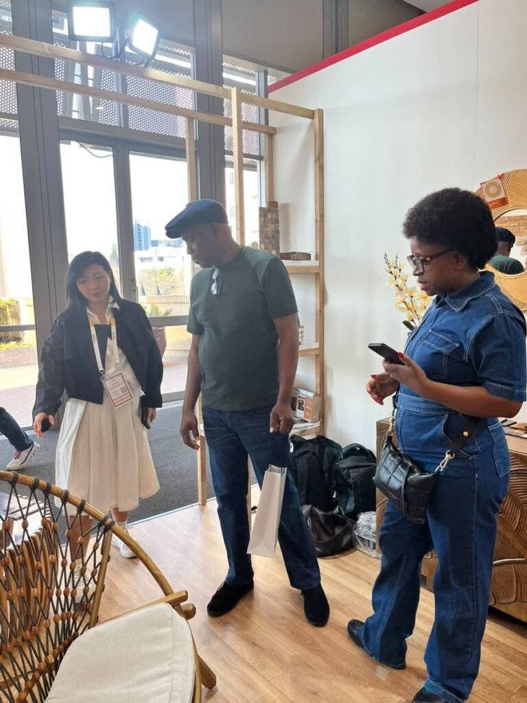 Visitors at the Indonesia Pavilion beside a teak rope chair, Decorex Johannesburg 2026